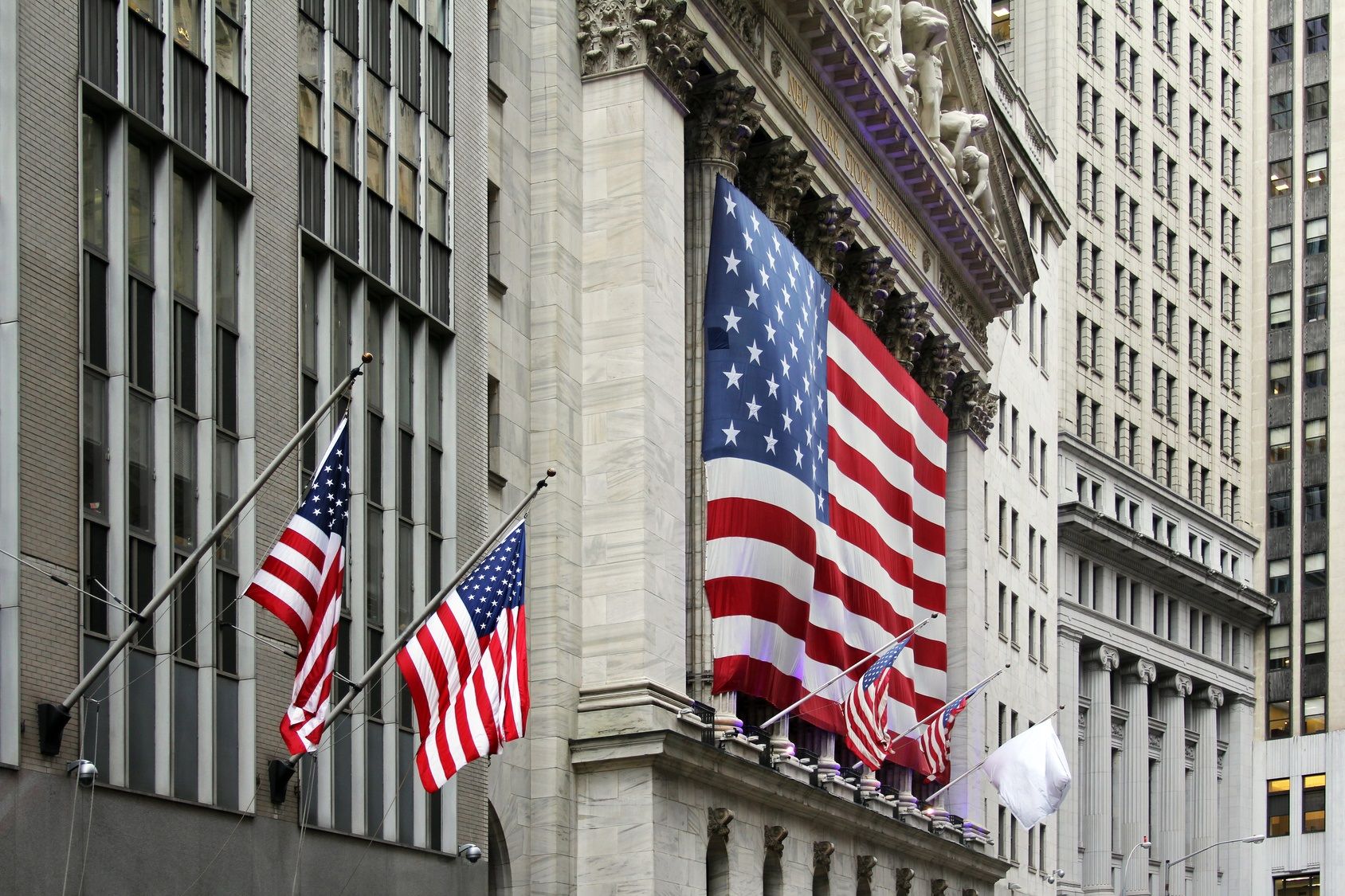 Front of NYSE with flags