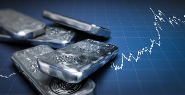 Silver bars with stock ticker background