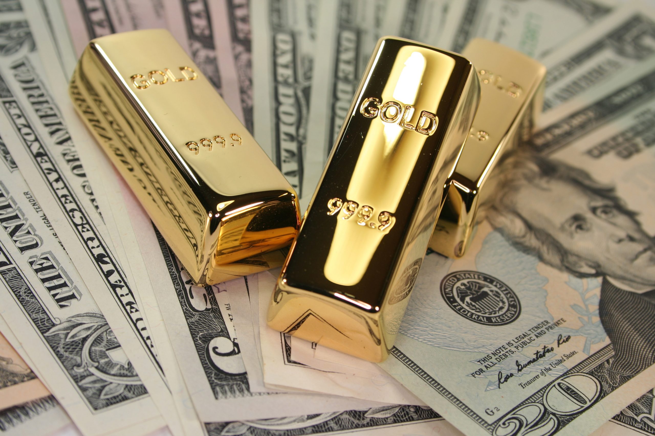 Goldv bars and American bills