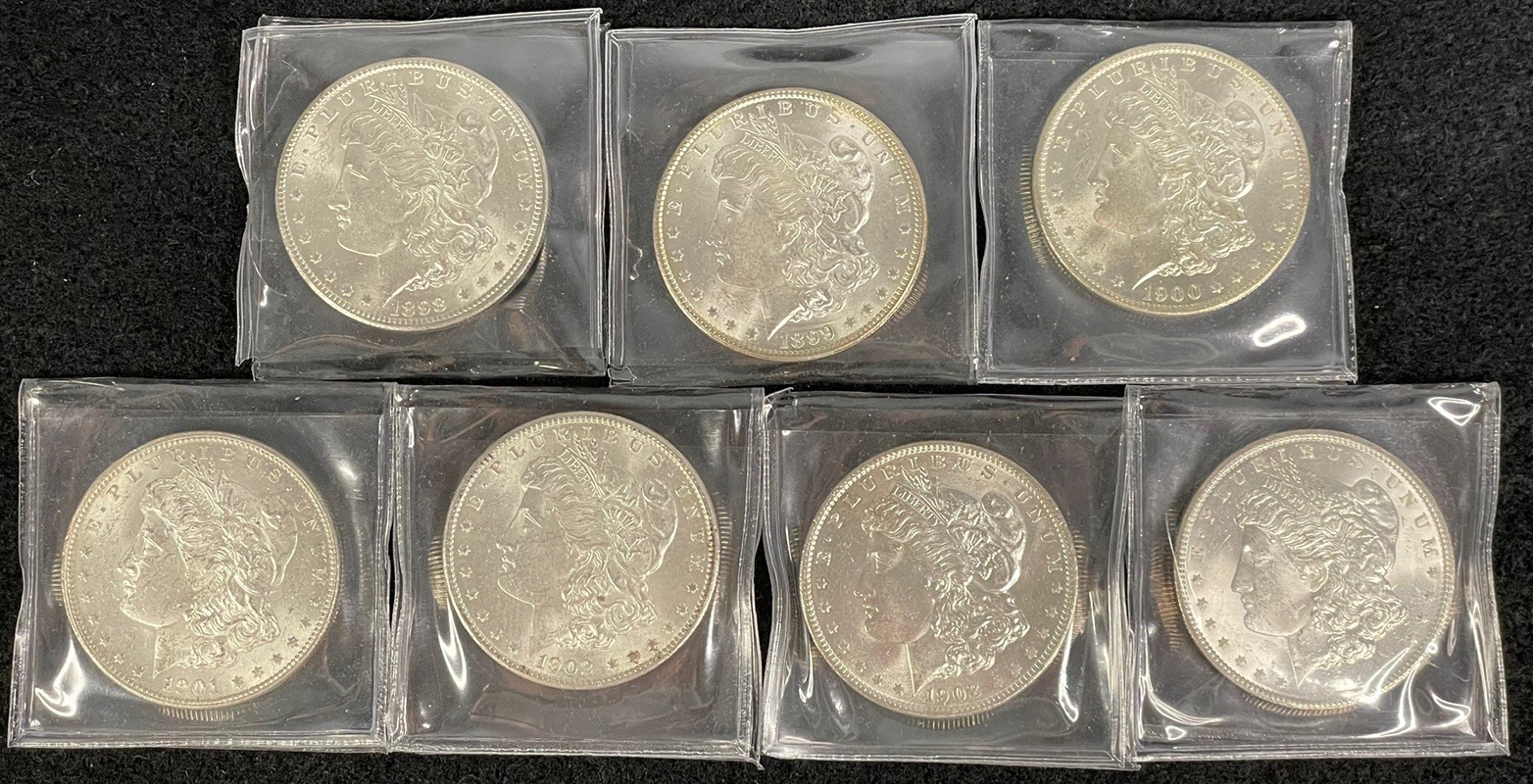 7-piece morgan dollar set obverse in BU condition. New Orleans mint mark