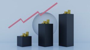 Bar graph with three black bars. Gold coins are atop each bar. Red arrow trending upward