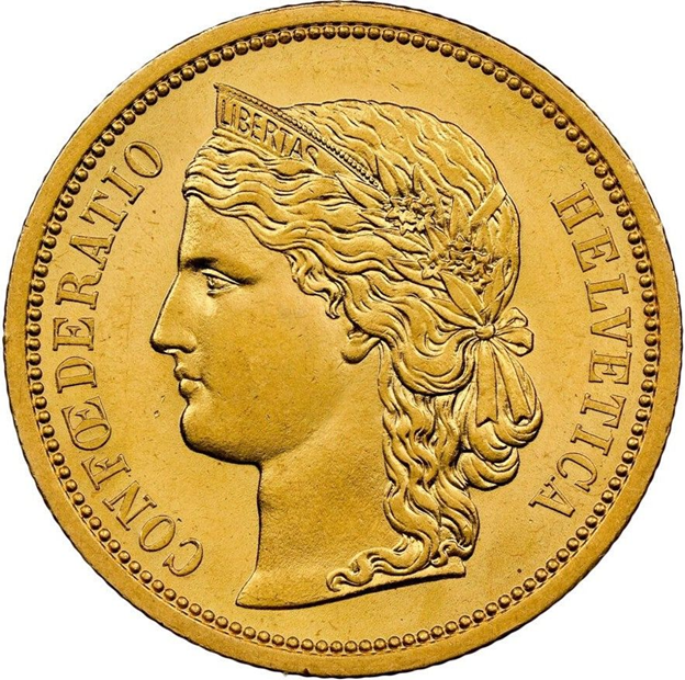 Head of Helvetia facing left wearing tiara and laurel wreath on Swiss 20 franc gold 