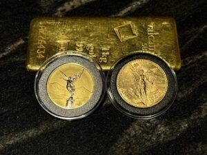 Mexican Centenario and Mexican Libertad gold coin side by side with gold bar.