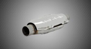 White ceramic catalytic converter showing internal honeycomb structure where platinum converts vehicle emissions 