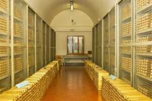 Gold-bars-stacked-inside-the-secure-vault-of-the-Bank-of-Italy-in-Rome-arranged-in-long-rows-behind-metal-cages