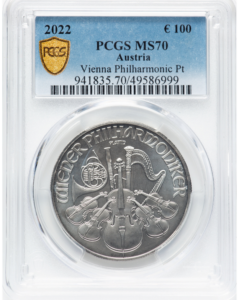 2022 Philharmonic platinum coin with €100 face value in PCGS MS70 slab showing reverse orchestral instrument design with PLATIN inscription.