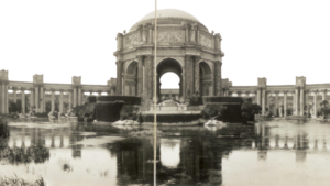Black and white photograph of the Palace of Fine Arts rotunda reflected in a lagoon at the 1915 Panama-Pacific International Exposition in San Francisco's Marina District.