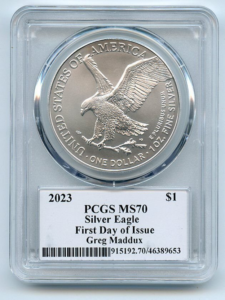 Reverse of a 2023 American Silver Eagle in a PCGS slab graded MS-70 with First Day of Issue designation and Greg Maddux hand-signed label, showing the landing eagle design and certification details