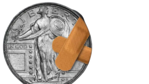 Standing Liberty quarter with bandages over damage, resting on scrap metal